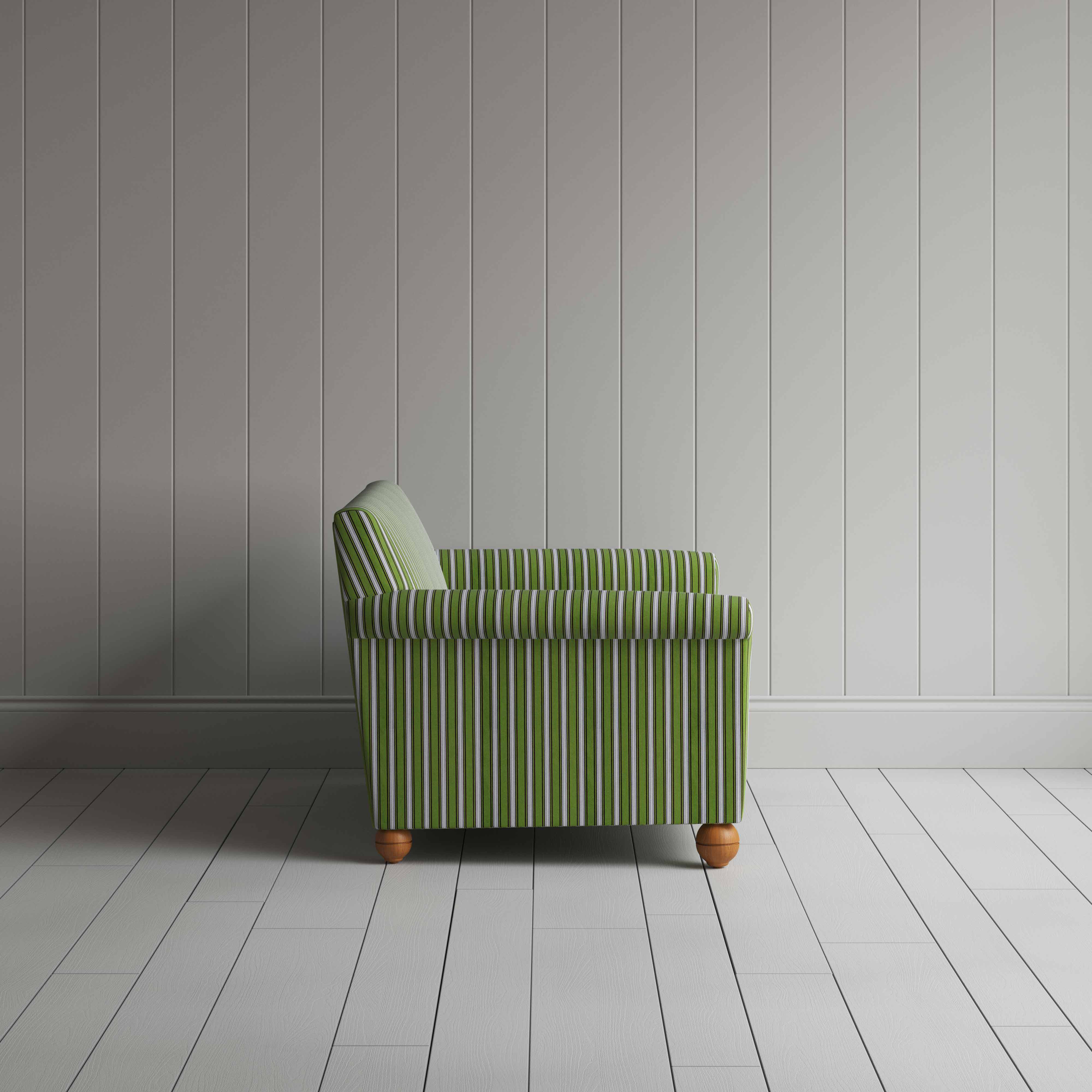Striped green and white couch by a wall.