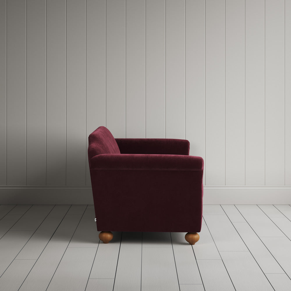 Side profile of the Cherry red corduroy Dolittle sofa
