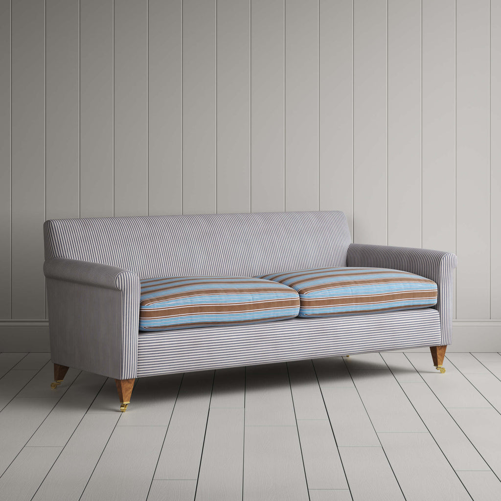 Angled view of the Ticking Blue Brown Idler sofa by NiX