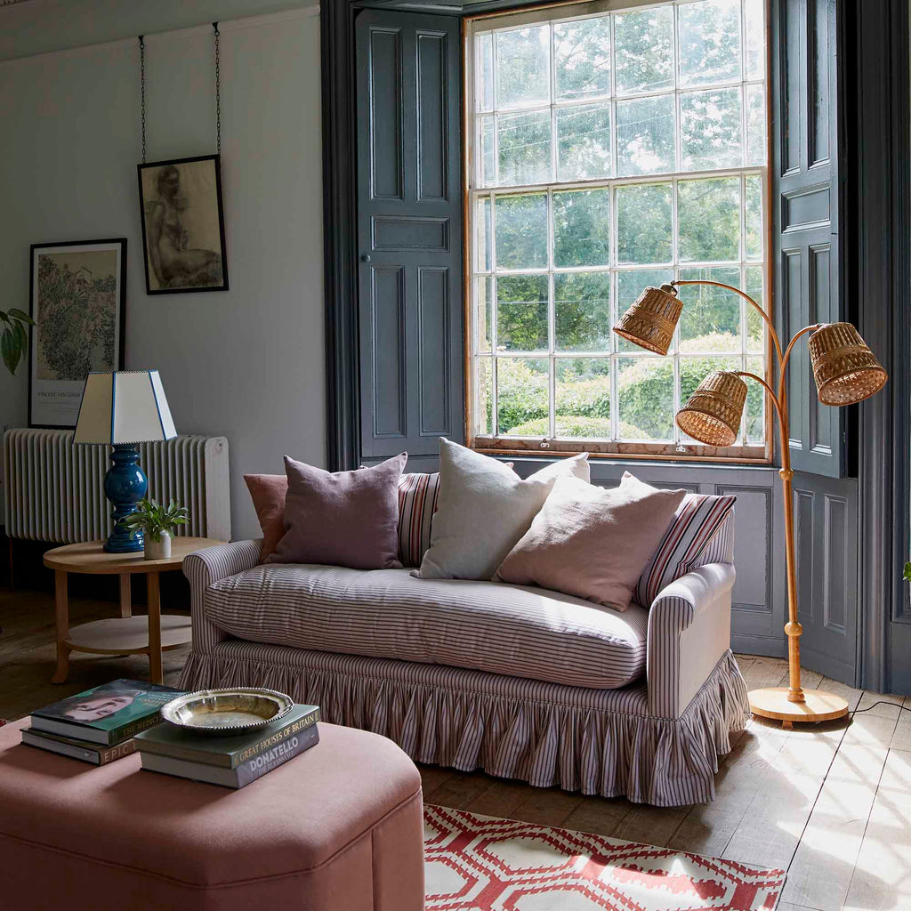 Curtain Call Sofa in Ticking Cotton, Berry, With NiX Cushions, Ottoman, Floor Lamp and a Side Table With Blue Base Lamp - NiX