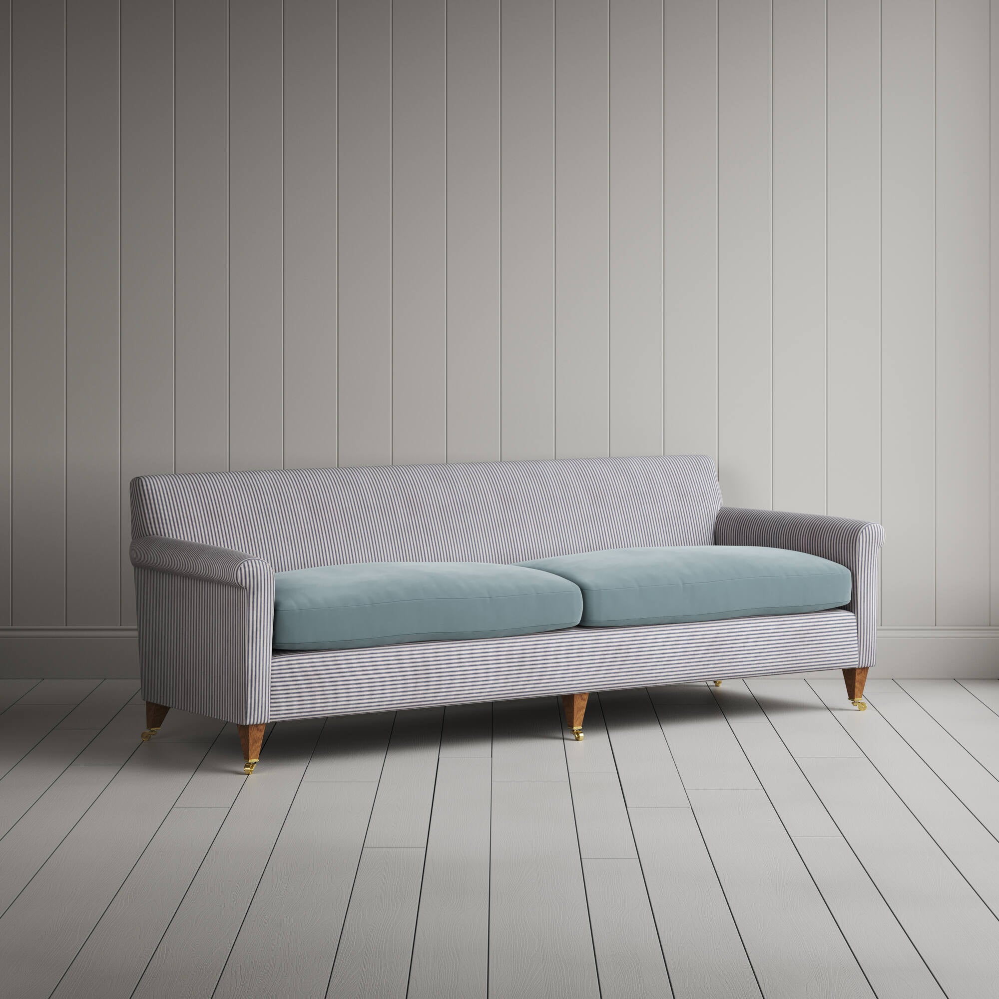 Angled view of the Ticking Blue Brown Idler sofa by NiX