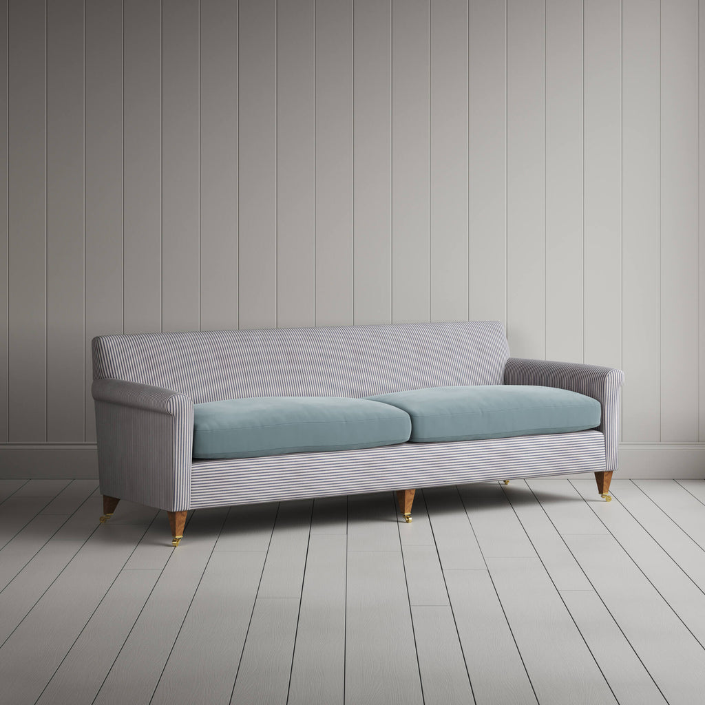 Angled view of the Ticking Blue Brown Idler sofa by NiX