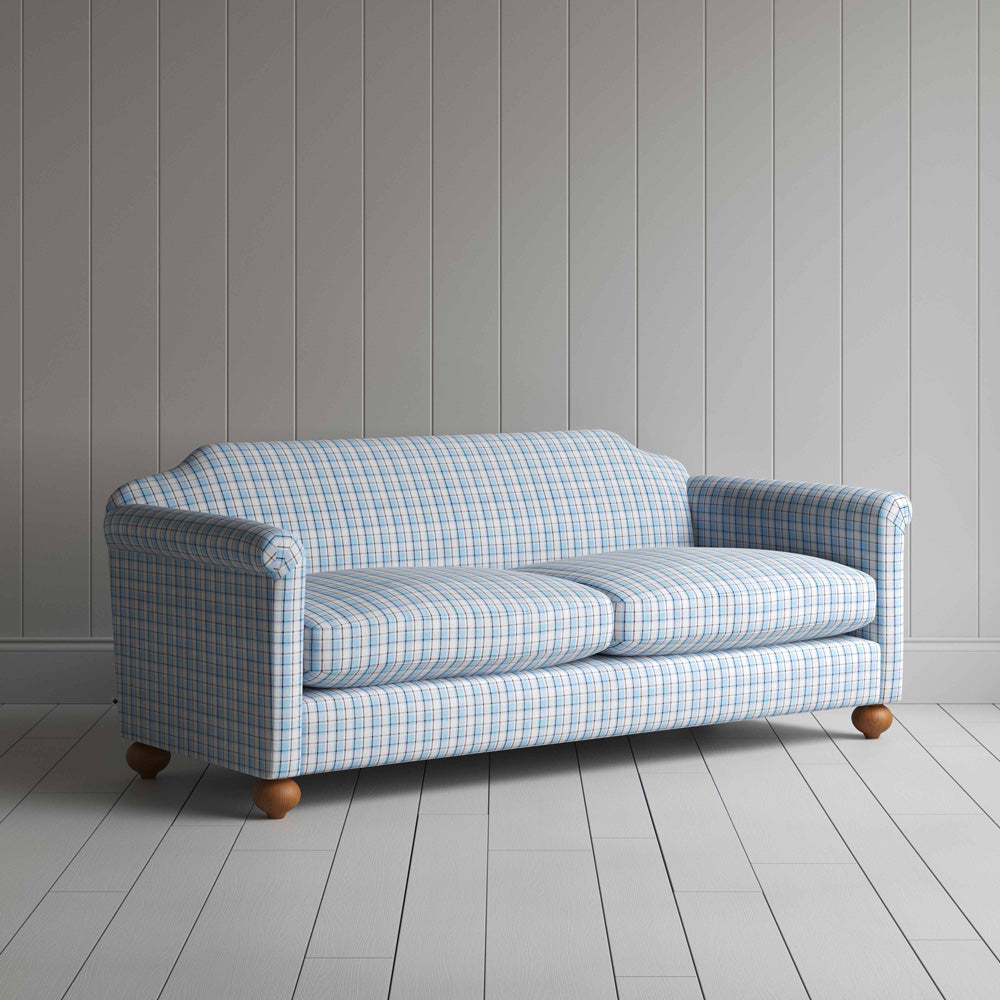 A close-up of a blue and white checkered sofa, showcasing its intricate pattern and inviting texture.