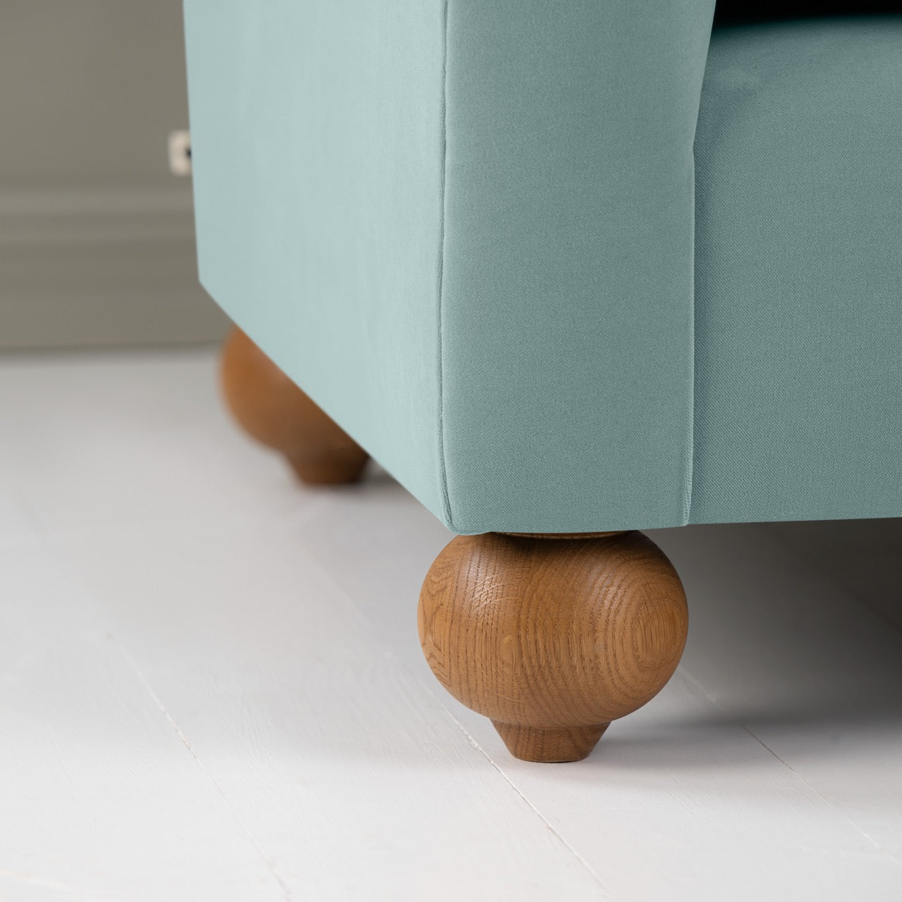 Dolittle 4 seater Sofa in Intelligent Velvet Mineral, Round Wooden Feet Closeup - Nicola Harding