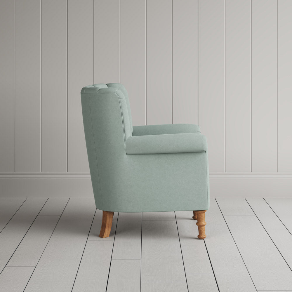 Time Out Armchair in laidback linen sky, side view by NiX.