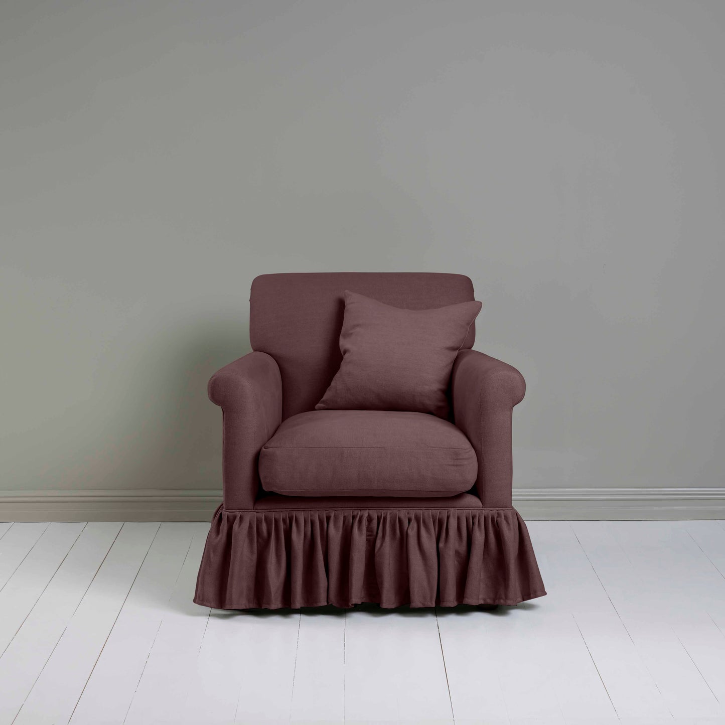 Curtain Call Armchair in Laidback Linen Damson, With a Matching NiX Special Square Cushion from Front View - Nicola Harding