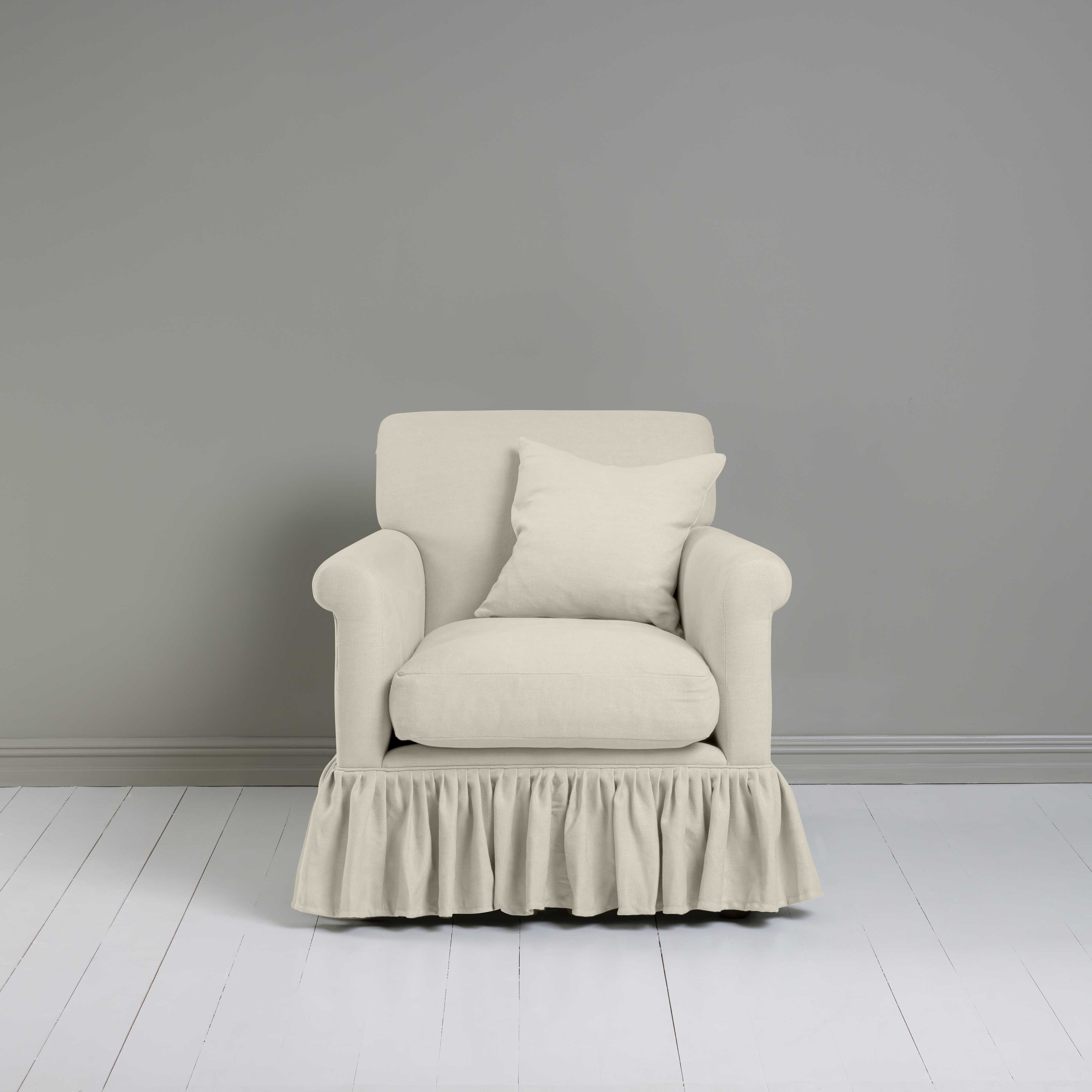 Curtain Call Armchair in Laidback Linen Dove, With a Matching Square Cushion from Front View - Nicola Harding