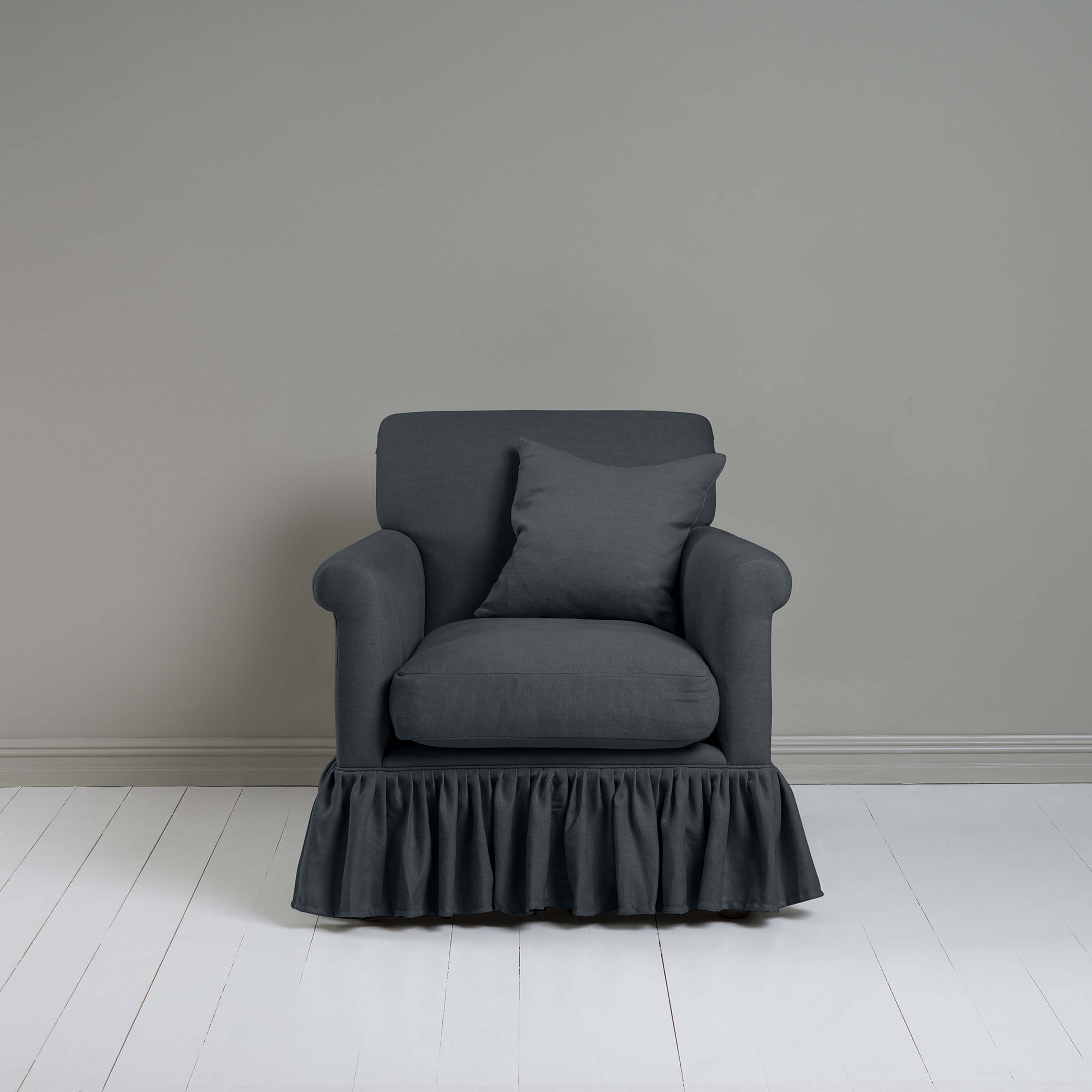 Curtain Call Armchair in Laidback Linen Midnight, With a Matching Square NiX Special Cushion from Front View - Nicola Harding
