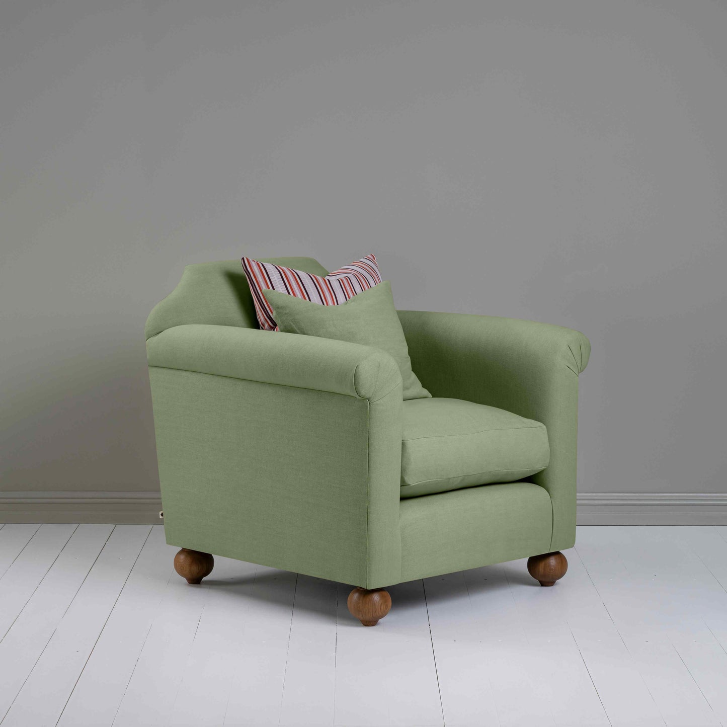 Dolittle Armchair in Laidback Linen Moss, Side View With Cushions - Nicola Harding