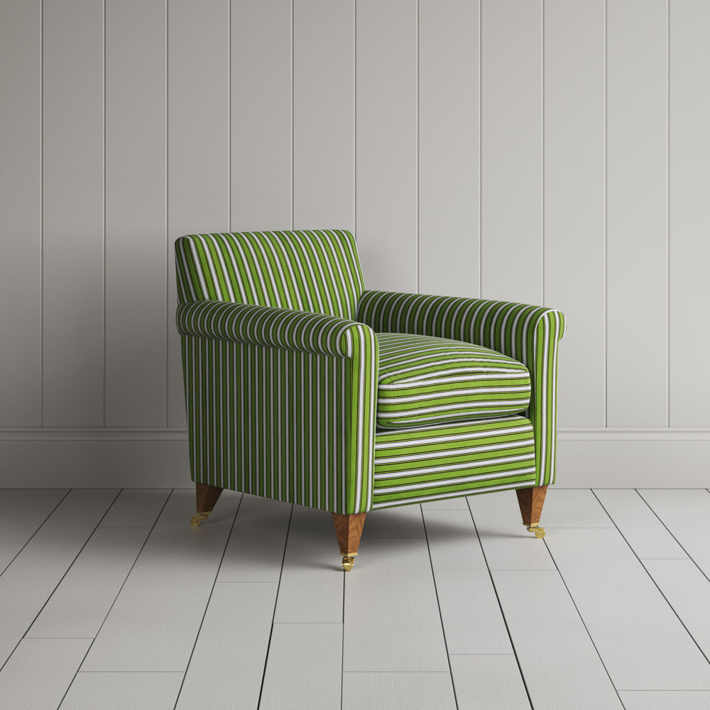 Striped green and white sofa by a wall.
