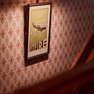 A picture on Rhombus Wallpaper in Rhubarb and Pink - Nicola Harding & Co.