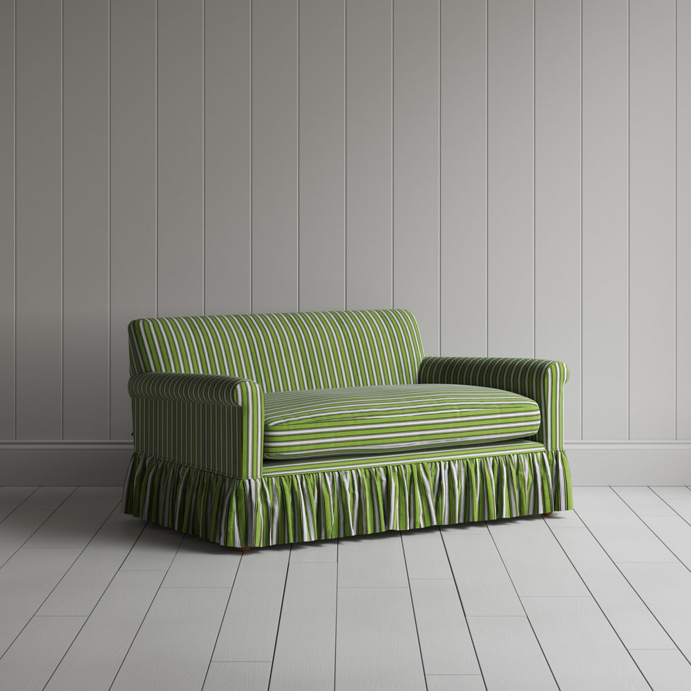 Angled view of Curtain Call love seat in Colonnade Cotton Green and Wine by Nicola Harding & Co