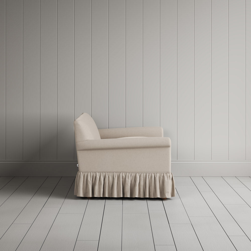 Side view showing the relaxed frame of the Curtain Call nix interiors sofa.