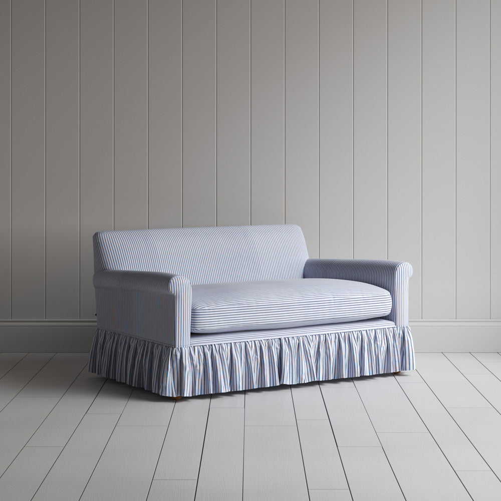 Three-quarter view of the Ticking Cotton Aqua Brown Curtain Call love seat by NiX.