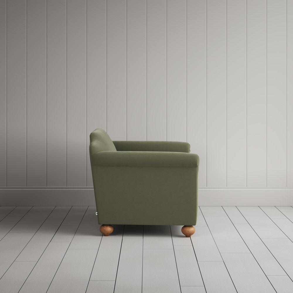 Side view showing the arched back profile of the NiX interiors Dolittle sofa.
