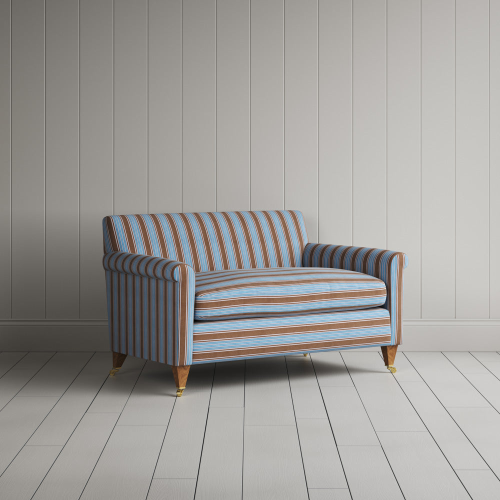 Angled perspective of the blue Regatta cotton love seat by Nicola Harding.