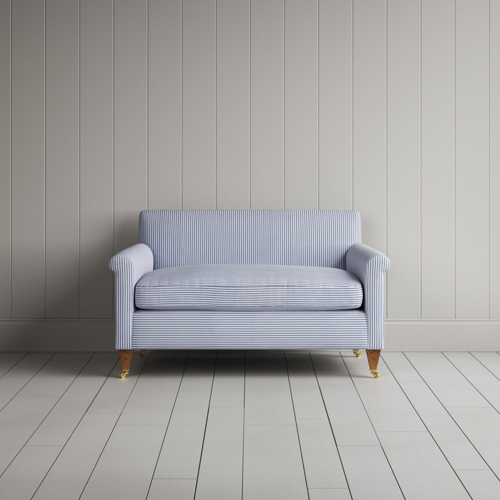 Front view of the Idler love seat in Aqua Brown ticking cotton by Nix.