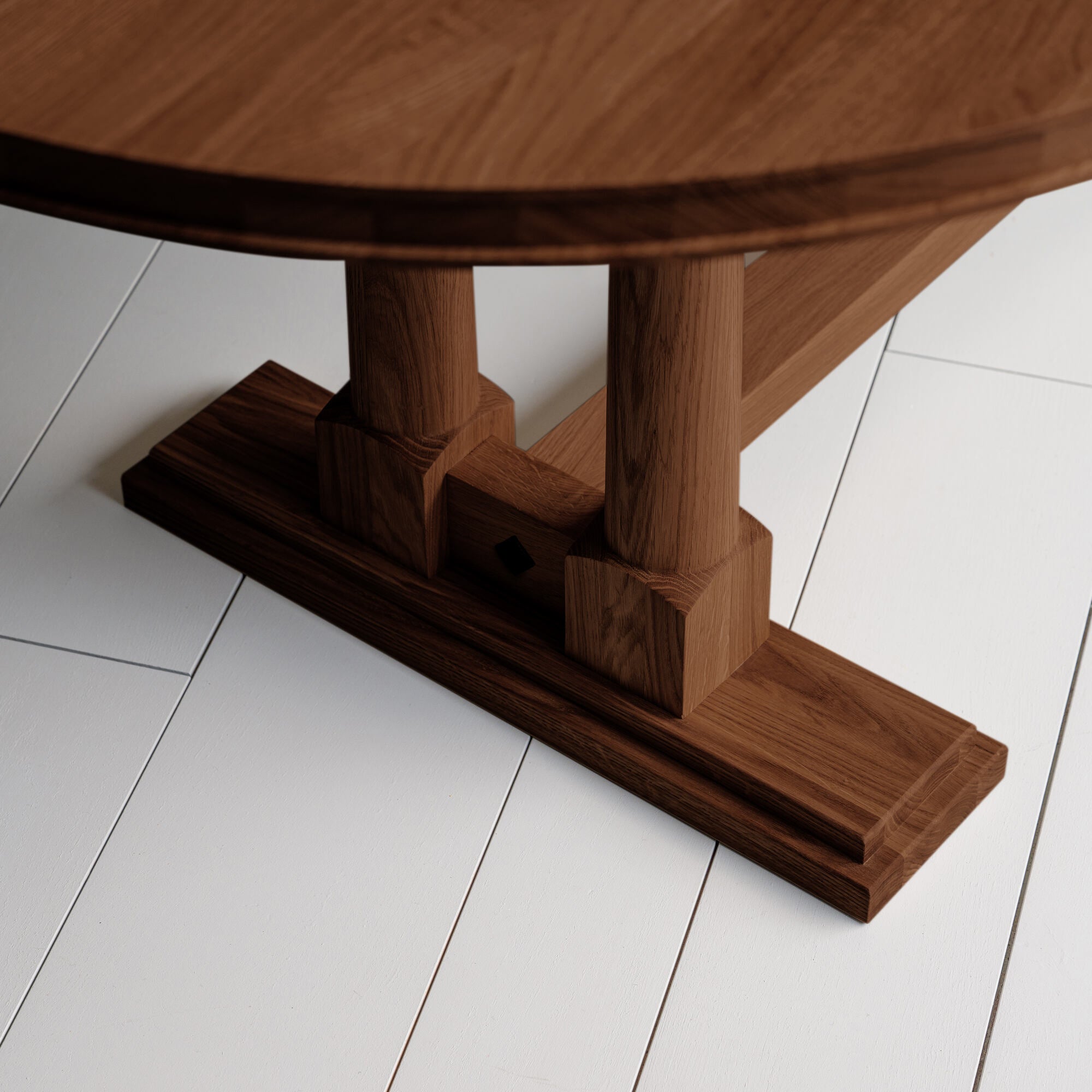 Foot Design of Tuck-In Oval Dining Table in Smoky Stained Oak - NiX By Nicola Harding & Co.