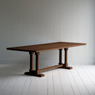 Side tile view of Tuck In rectangular dining table in smoky stained oak wood, by NiX.