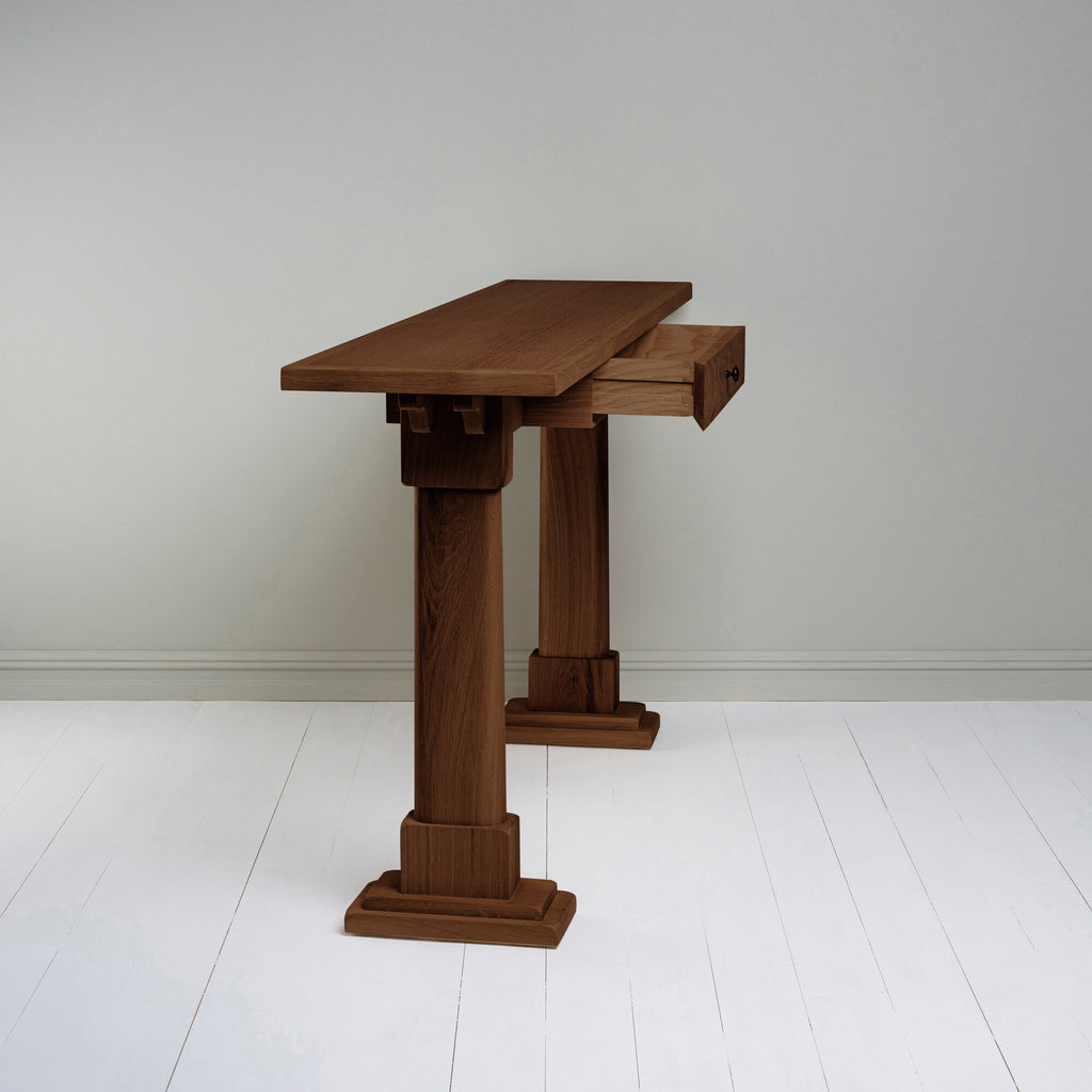 Console Table in smoky stained oak with an open drawer, designed by Nicola Harding & Co.