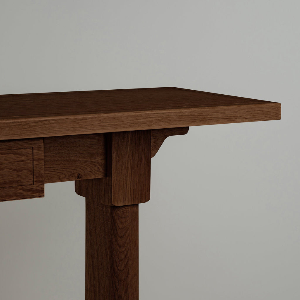 Design close-up of the Keepsake Console Table in smoky stained oak, highlighting the texture and craftsmanship.