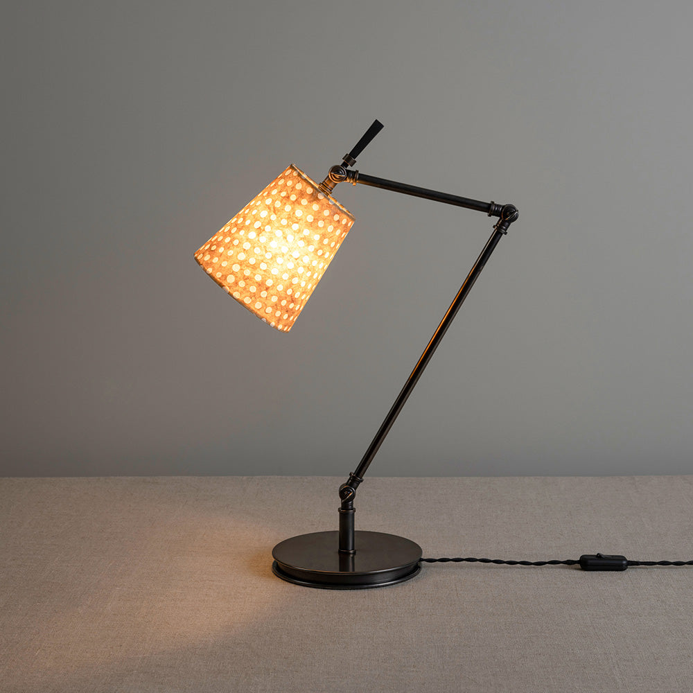 Focused Table Lamp Base in Waxed Brass, Lights 'ON' With Focused Empire Batik Paper Lamp Shade in Spotty Dotty Tan - Nicola Harding