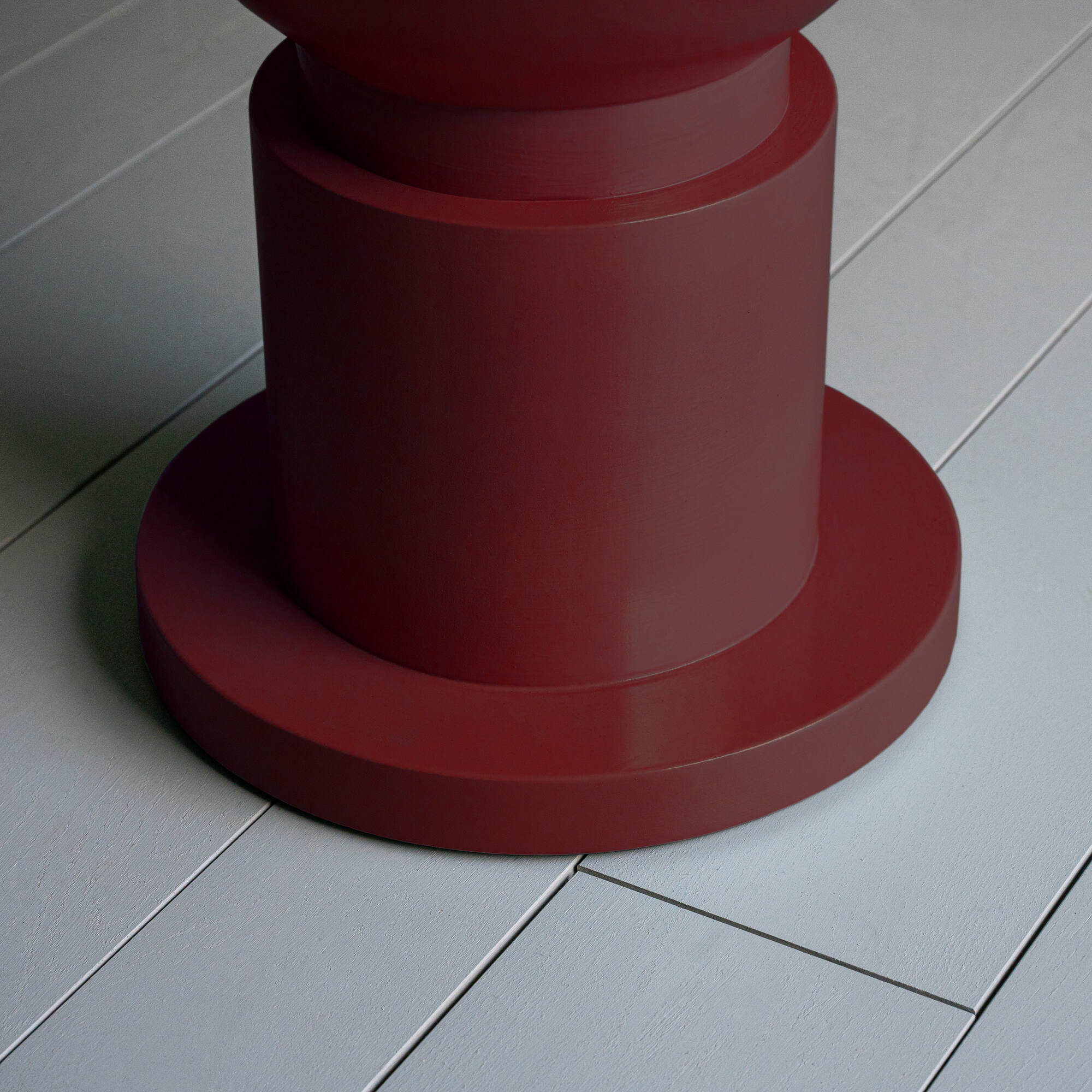 Raconteur Dining Table in Berry Red Base Design Closeup - NiX