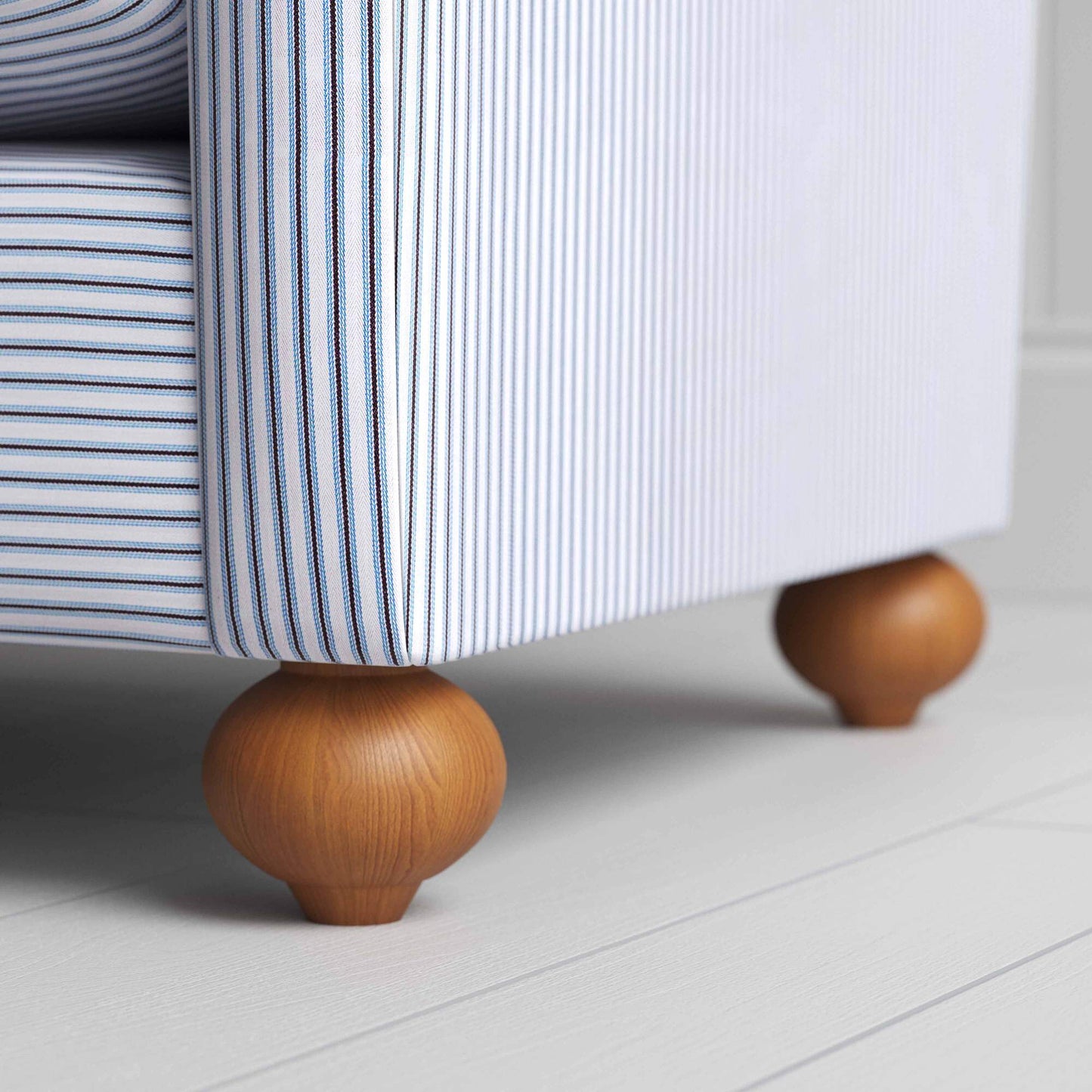 Wooden Foot Design Closeup of NiX Seating in Ticking Cotton, Aqua Brown, – Nicola Harding & Co.