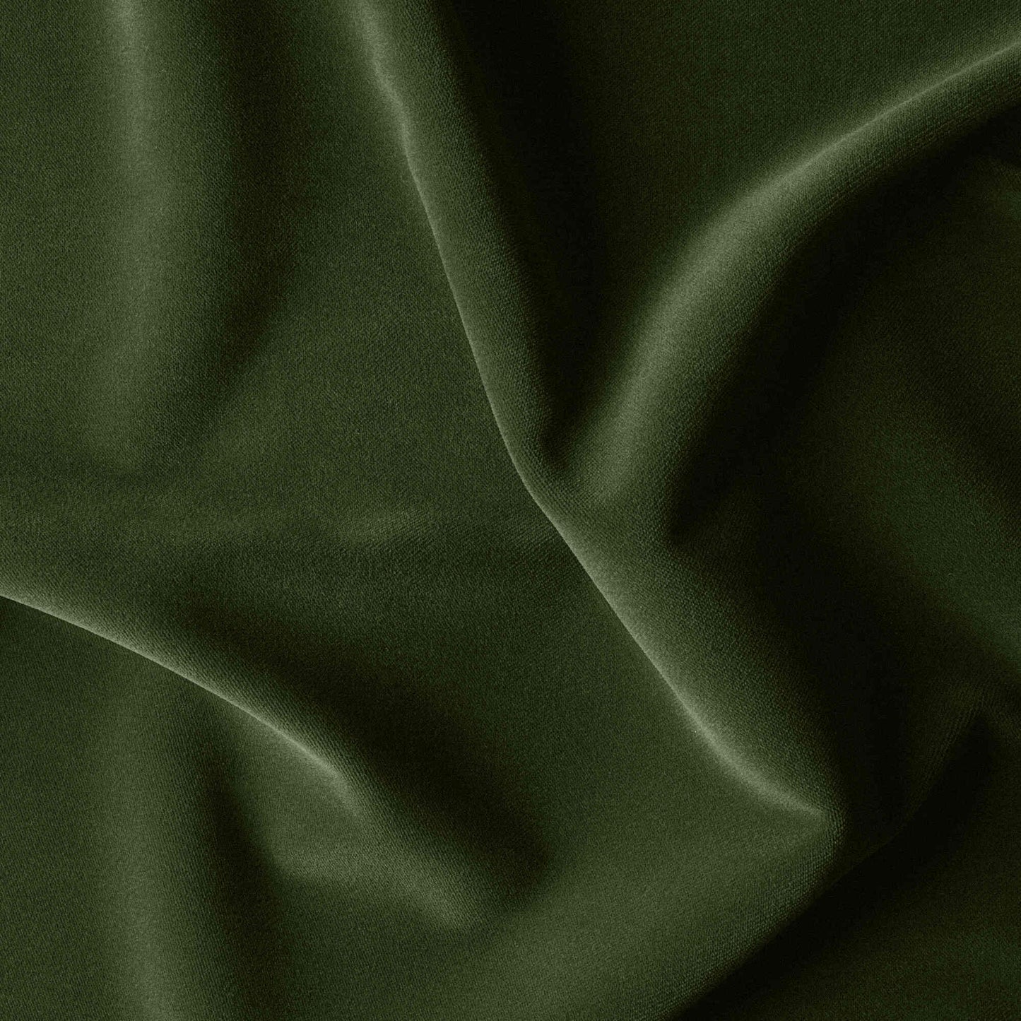 A close-up of a lush green velvet fabric with a smooth texture, perfect for luxurious upholstery or elegant clothing.