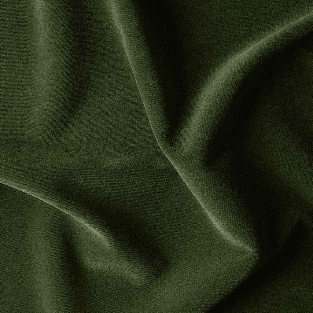 A close-up of a lush green velvet fabric with a smooth texture, perfect for luxurious upholstery or elegant clothing.