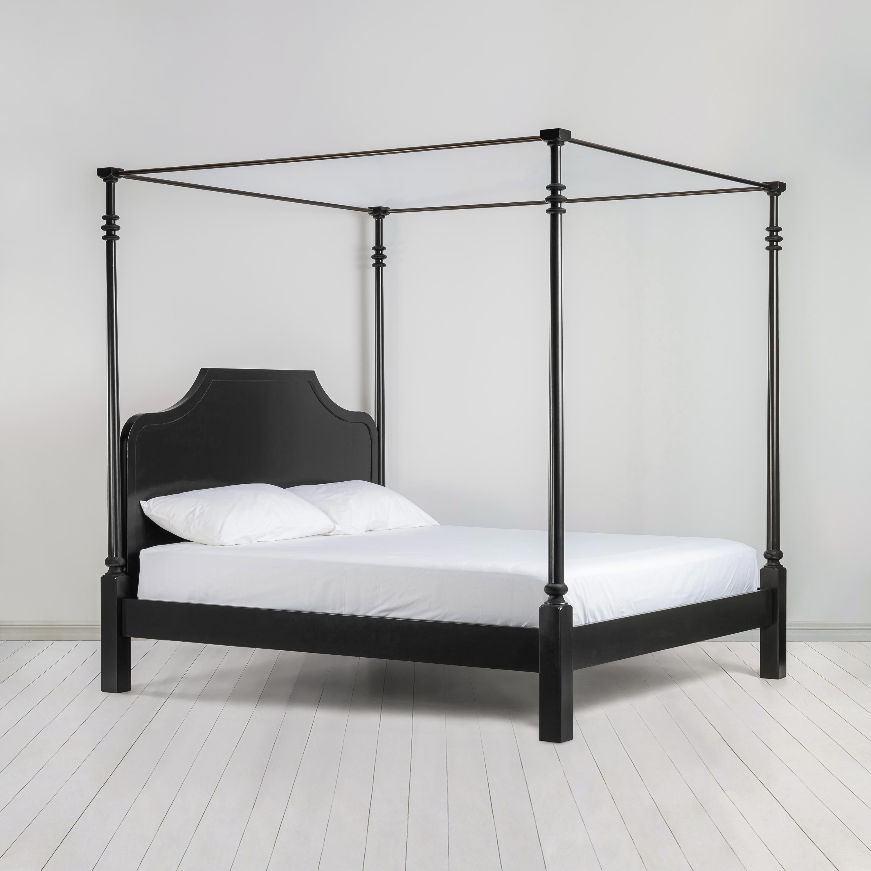 Folly Four Poster Bed in Jet Black Side View with Mattress and Pillows - Nicola Harding