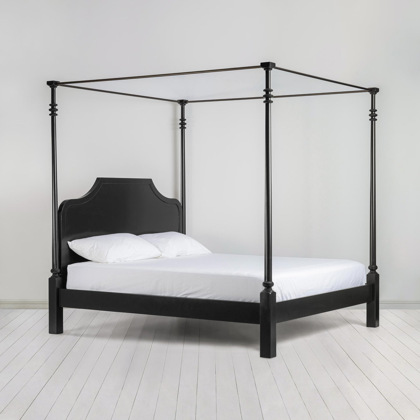 Folly Four Poster Bed in Jet Black Side View with Mattress and Pillows - Nicola Harding