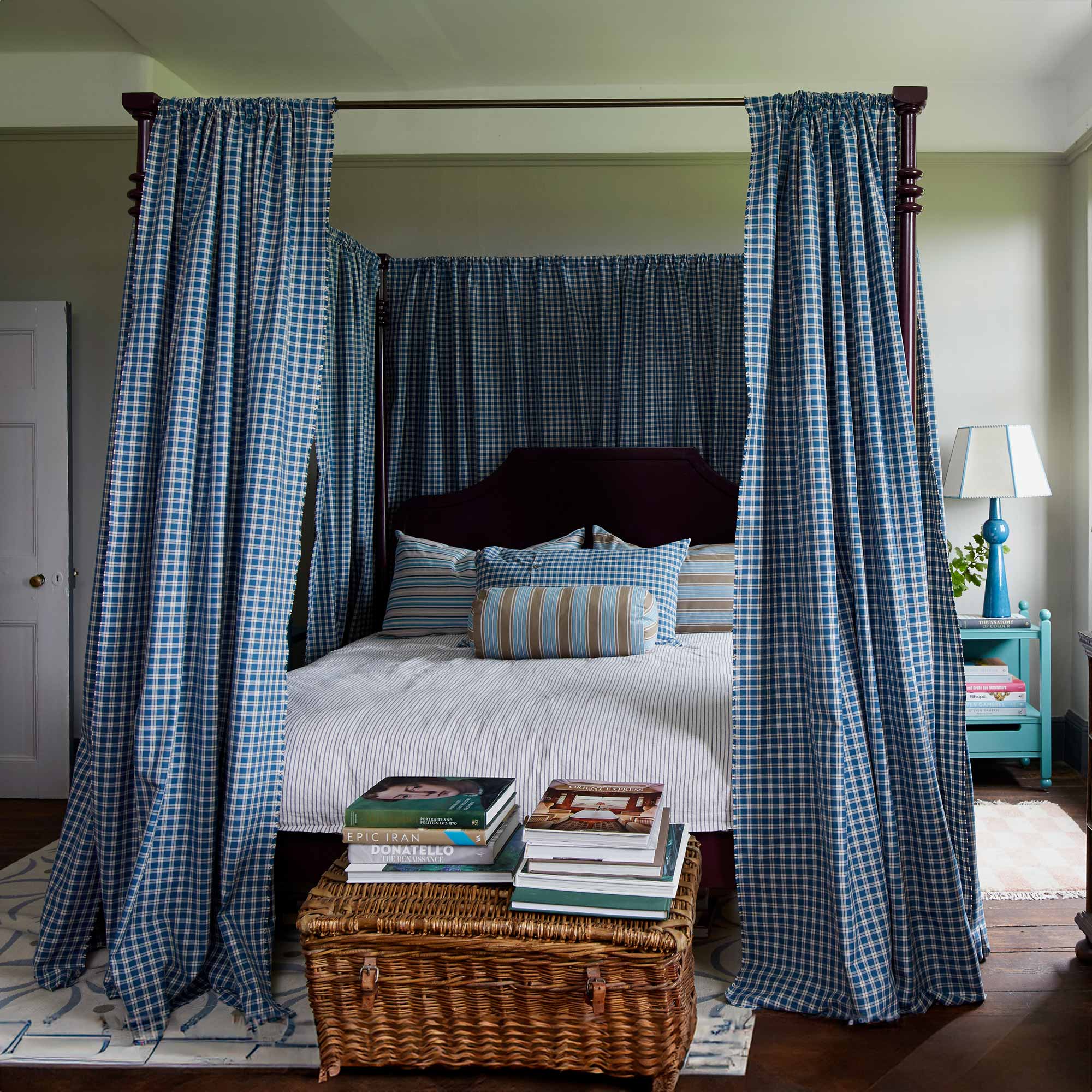 A beautifully decorated bedroom featuring the Folly Four Poster Bed in Plum, designed by NiX by Nicola Harding & Co.