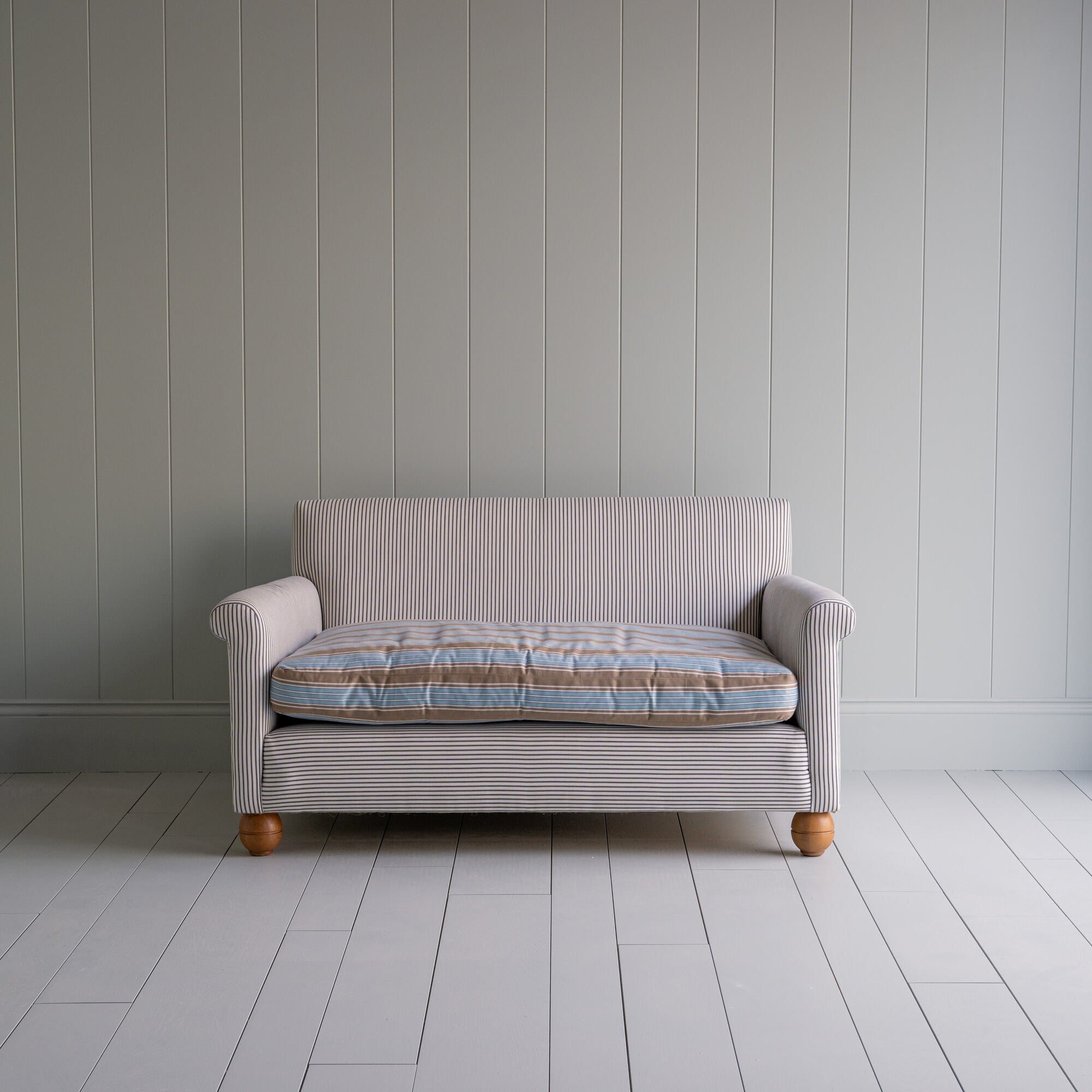 Front View of Idler 2 Seater Sofa in Ticking Cotton Chocolate Navy Frame and Regatta Blue Seat - By NiX