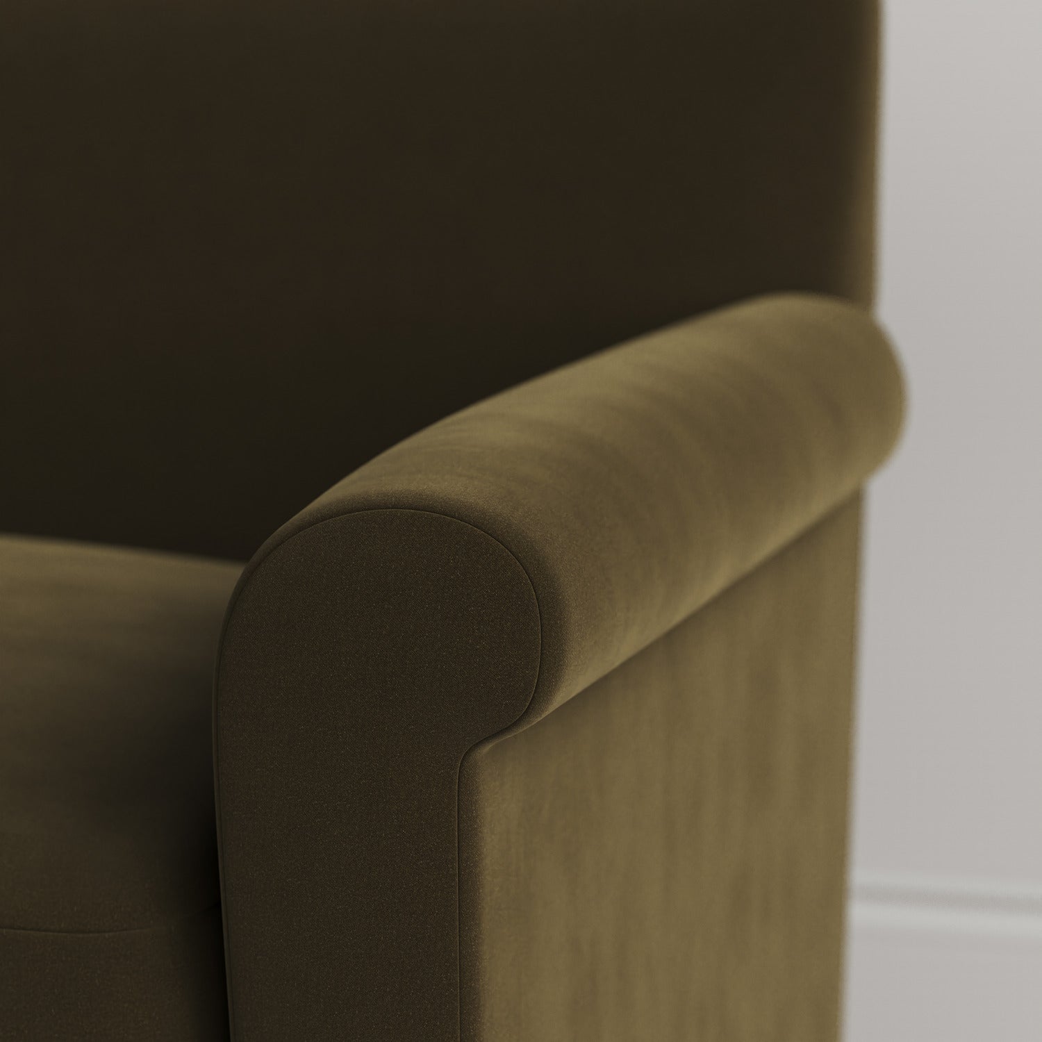 Close-up of the tailored armrest on the Seaweed velvet Idler by Nix.