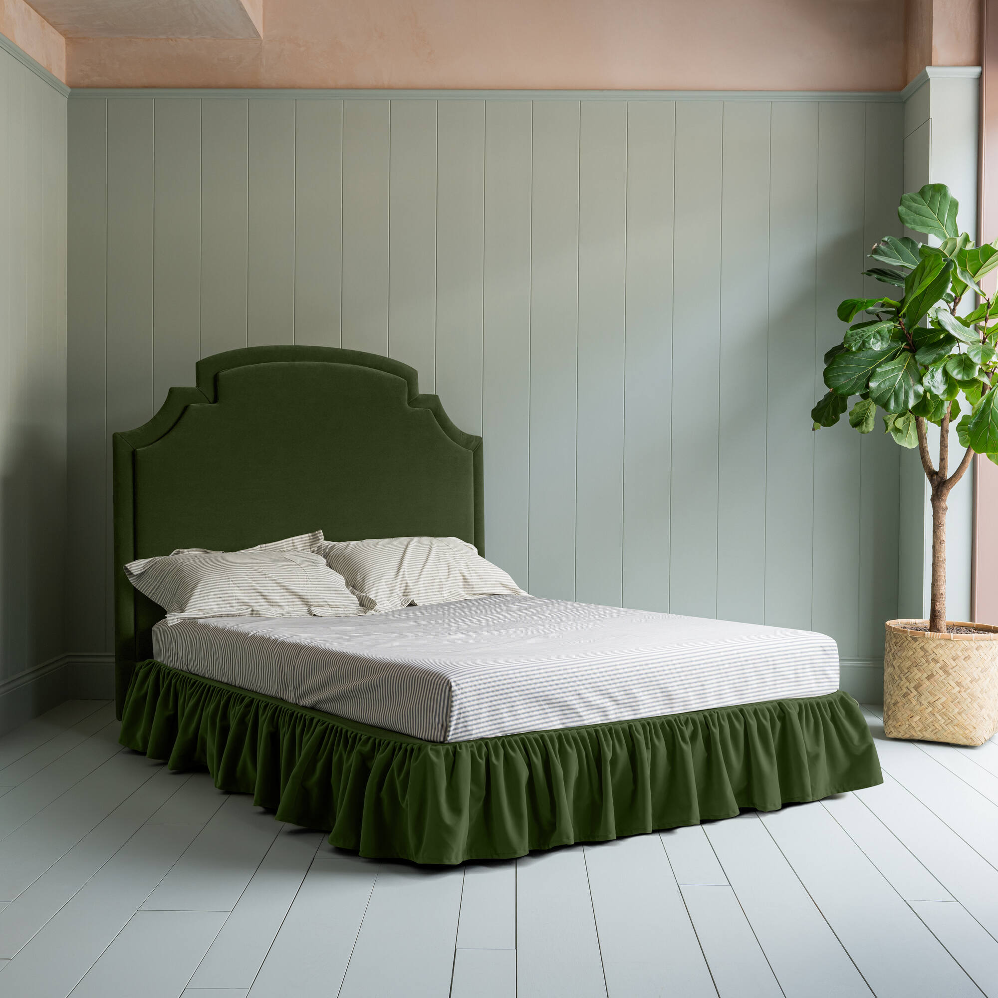 Seventh Heaven Upholstered Bed in Intelligent Velvet Juniper with Ruffled Valance complete bed picture with an indoor plant on the left.