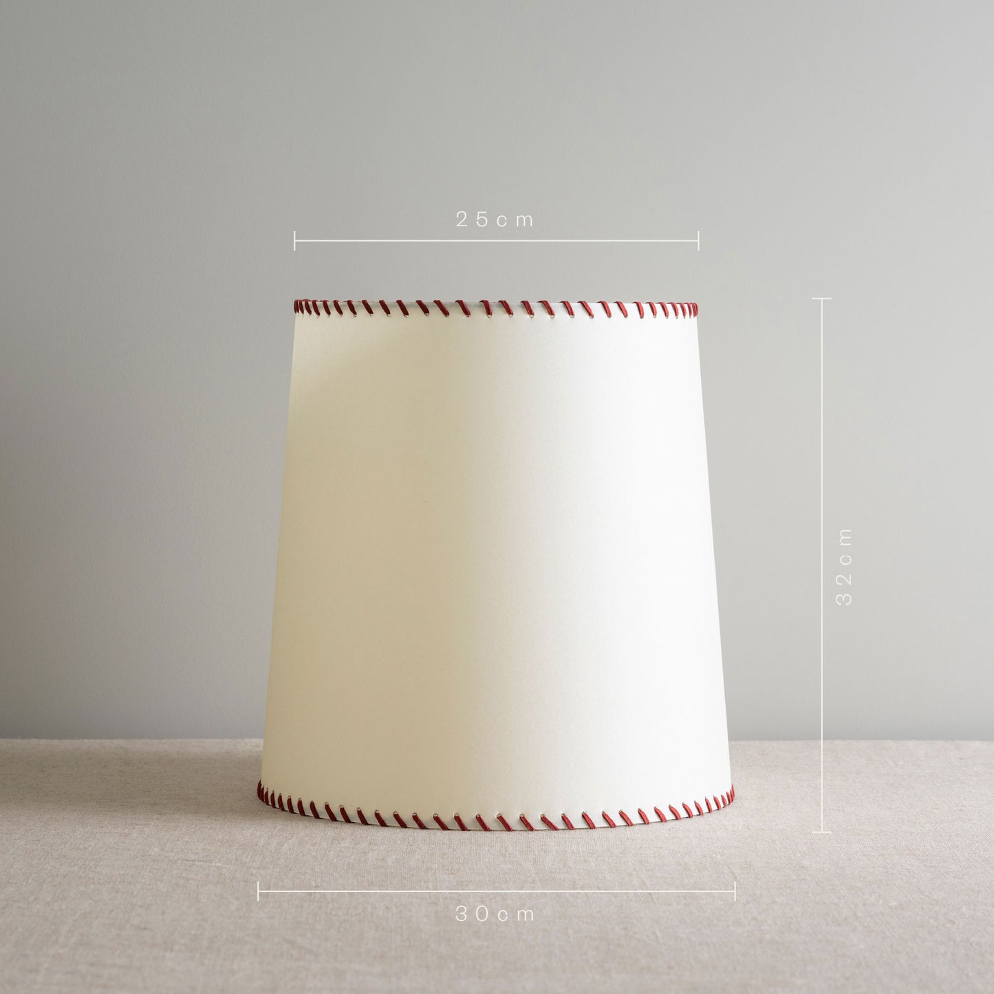 Modern white lamp featuring stylish red stitching for a touch of elegance. With Measurements in 'cm'
