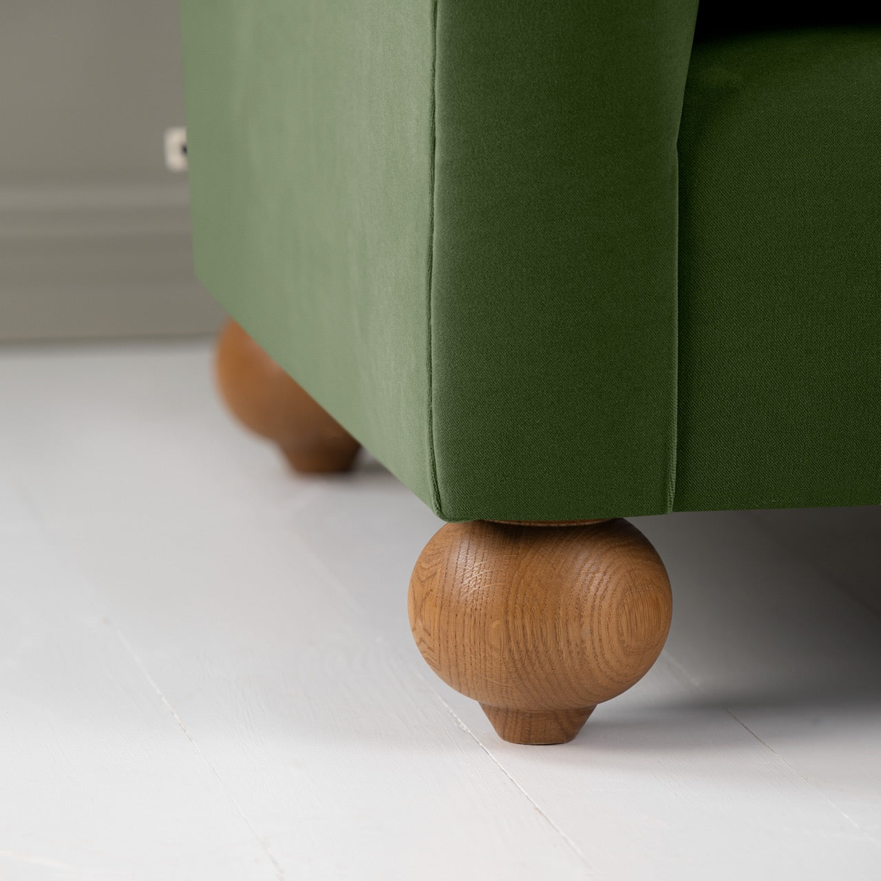 Dolittle Love Seat in Intelligent Velvet Juniper, With Round Wooden Foot Closeup - Nicola Harding