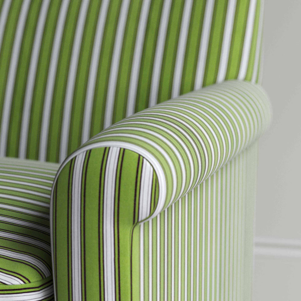 Detailed view of a green and white striped sofa.