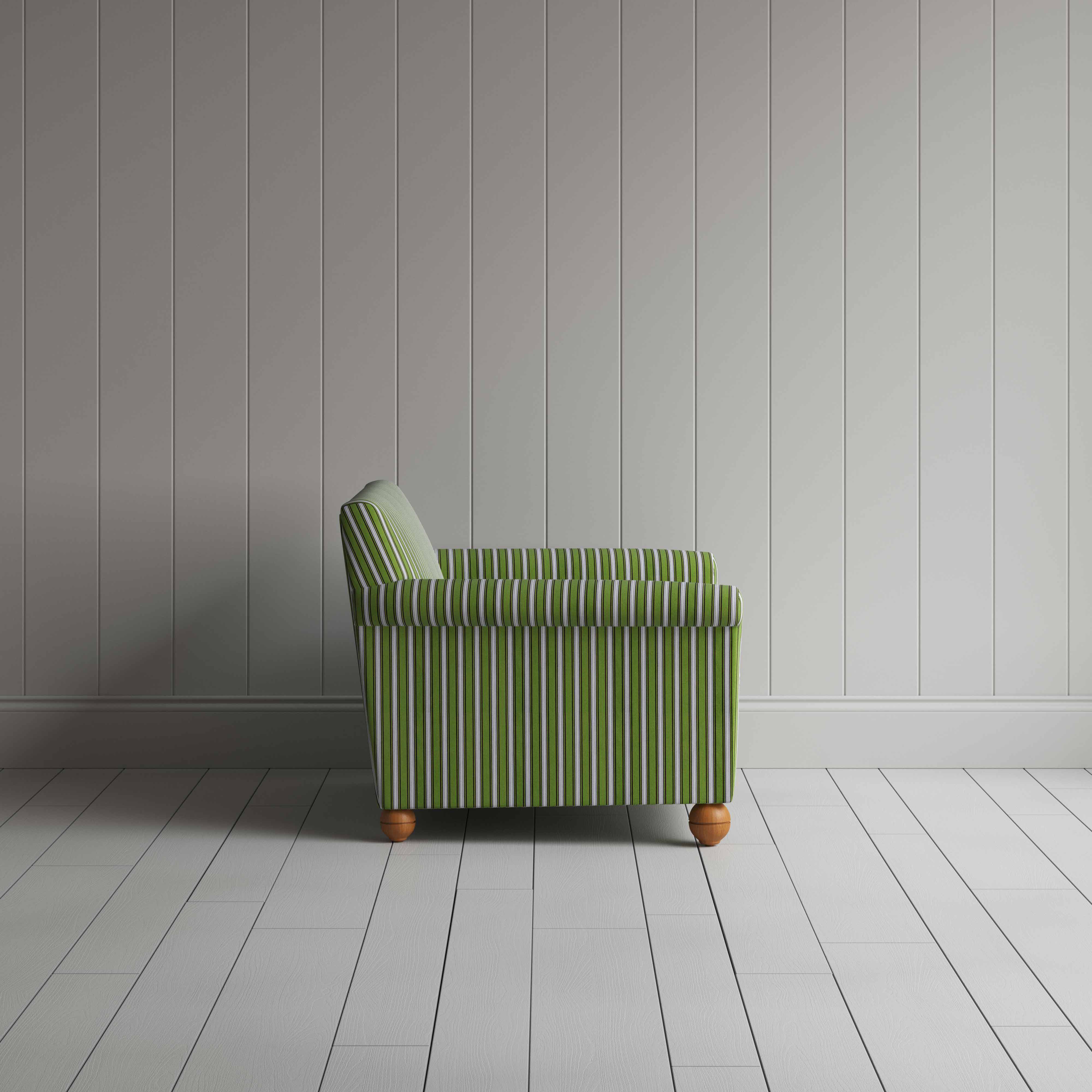Striped green and white couch by a wall.