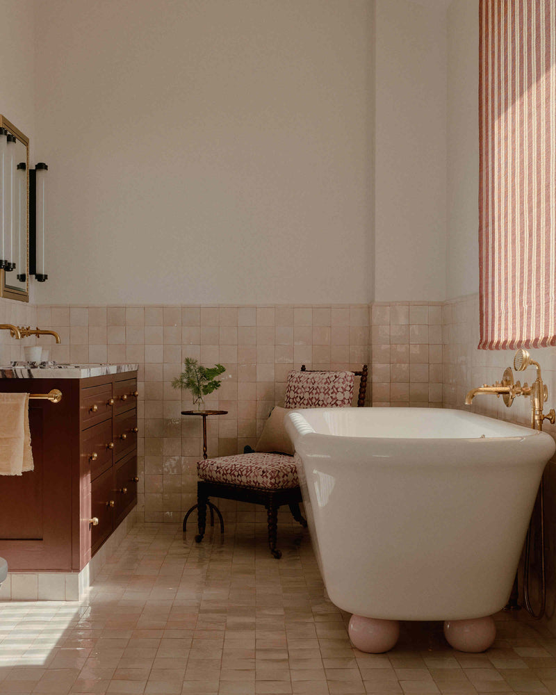 Luxurious bathroom showcasing a designer bathtub by Nicola Harding & Co.