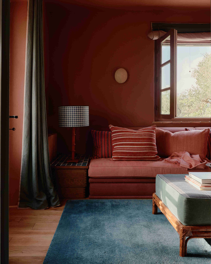 Red living room drafted by the Nicola Harding & Co. team.