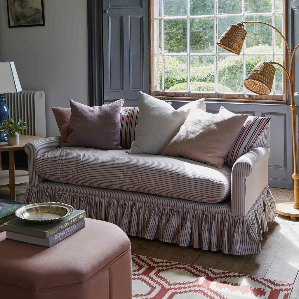 Curtain Call Sofa in Ticking Cotton, Berry, With NiX Cushions, Ottoman, Floor Lamp and a Side Table With Blue Base Lamp - NiX