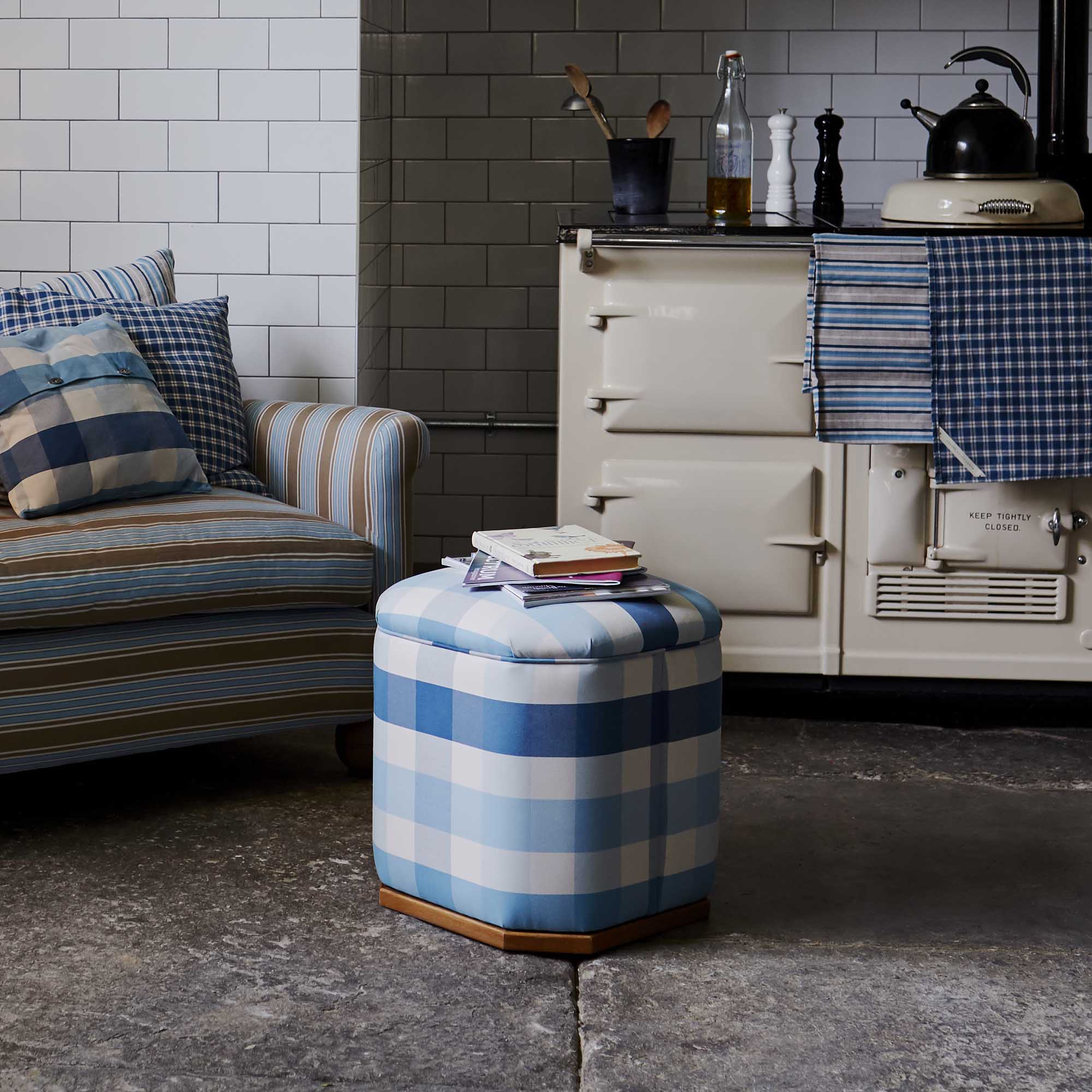 Loveseat With Cushions and ottoman with Books is perfectly placed in the Living Room - NiX