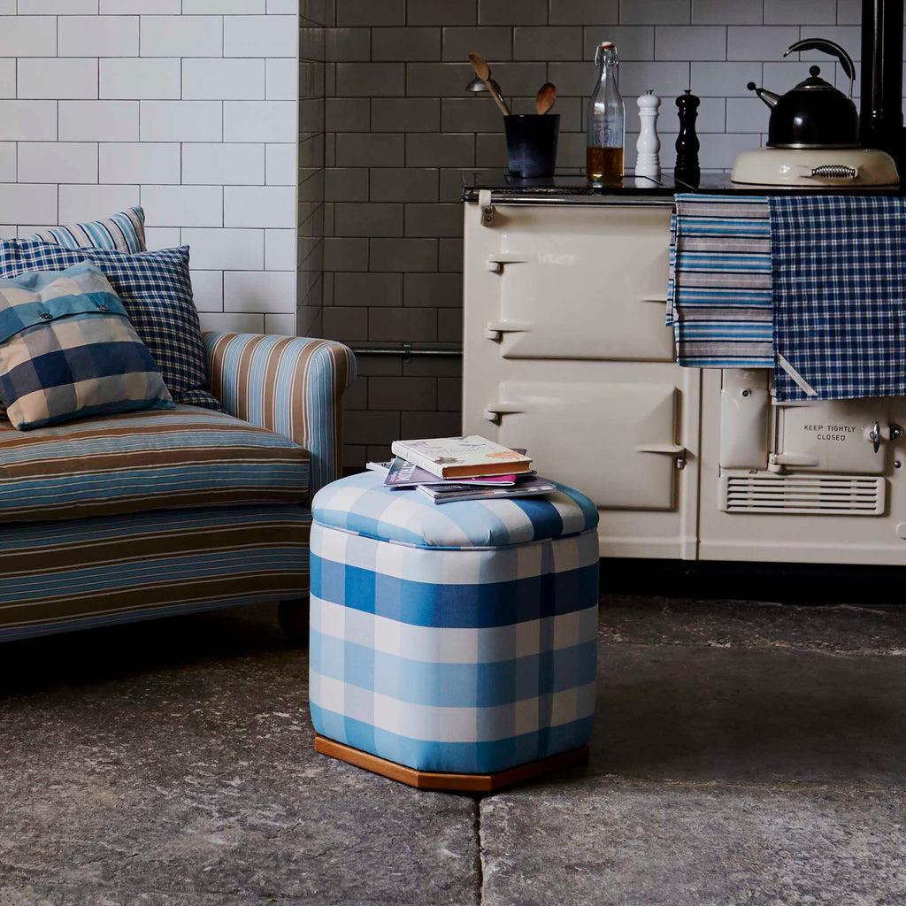 Loveseat With Cushions and ottoman with Books is perfectly placed in the Living Room - NiX