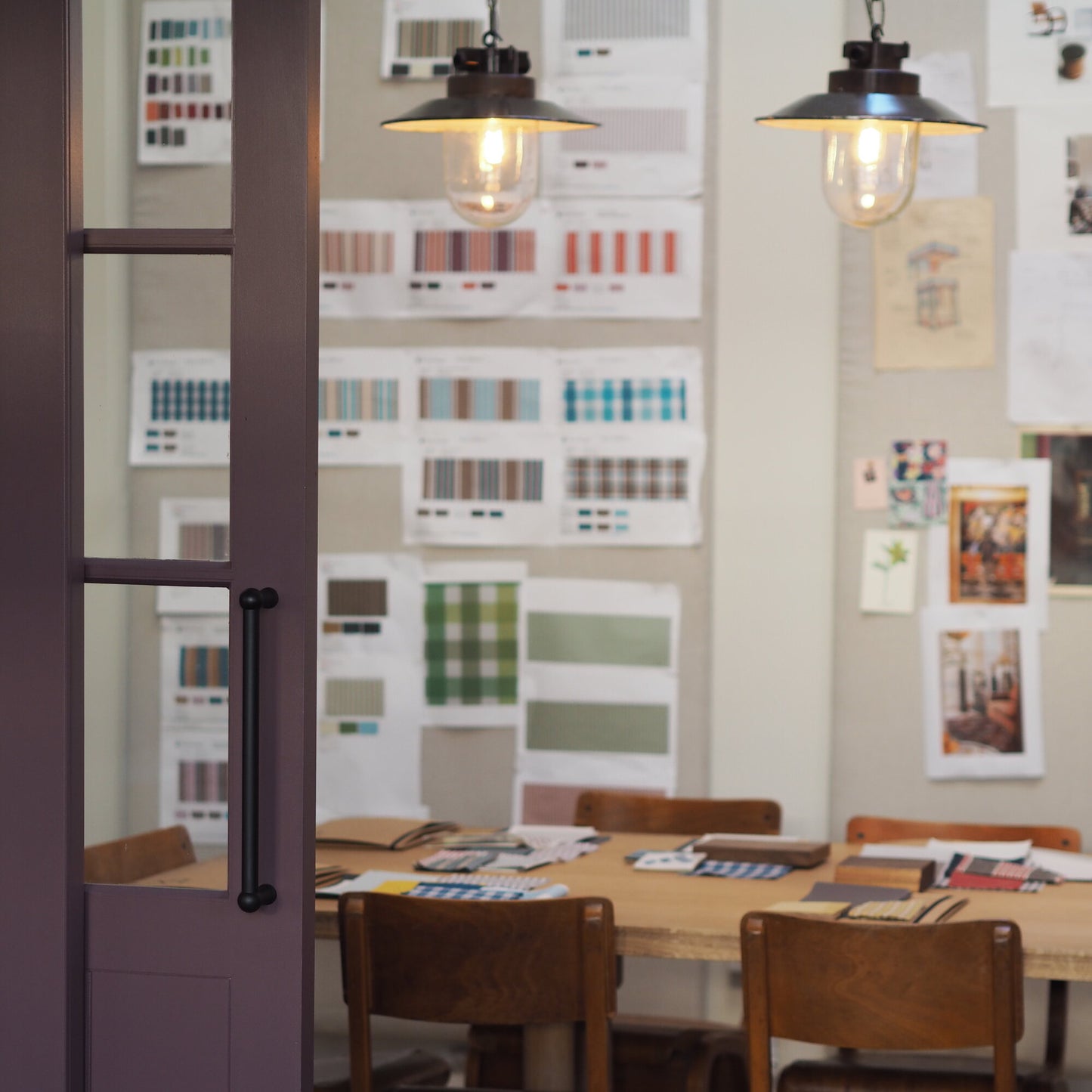 Dining Table with Lots of pictures on the wall - NiX