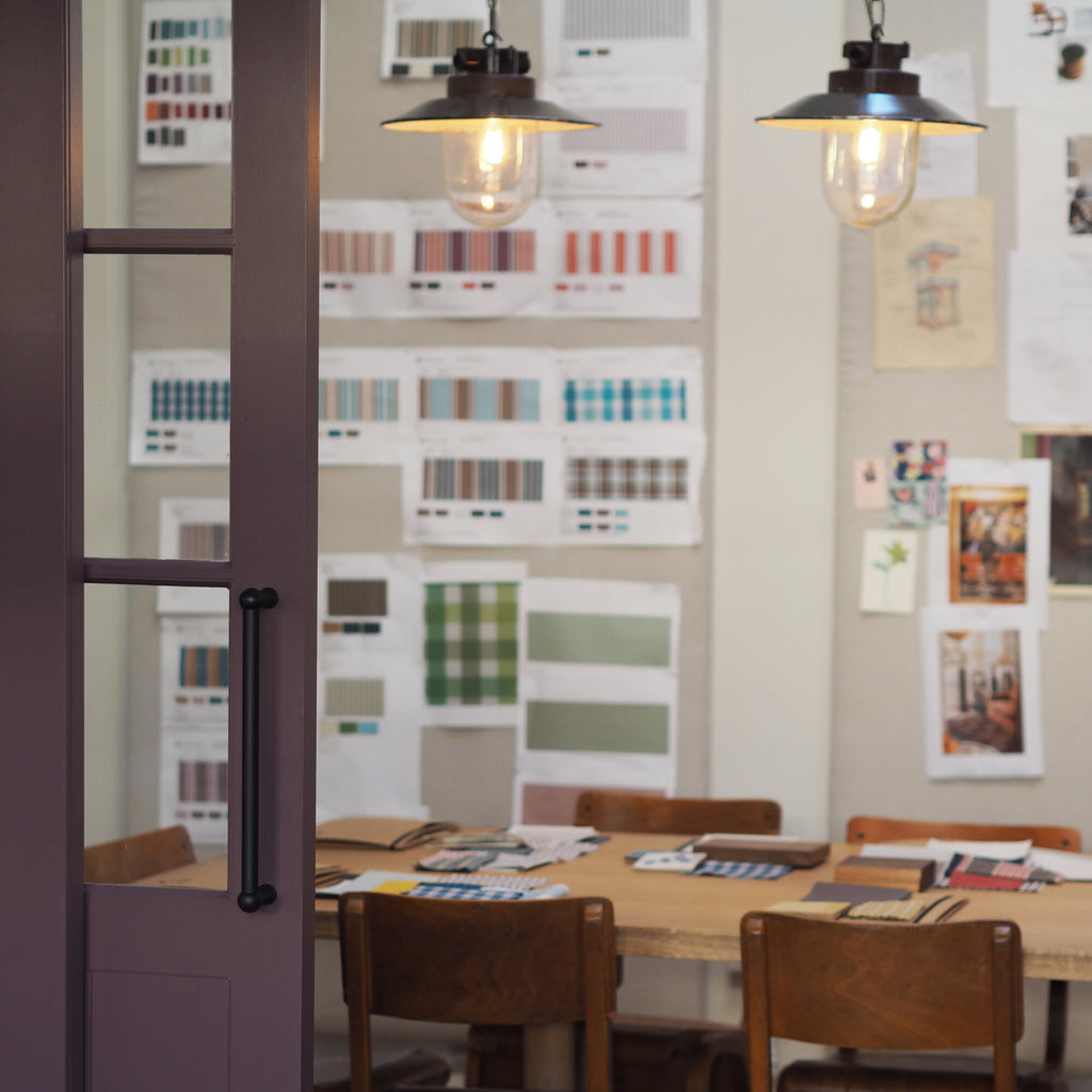 Dining Table with Lots of pictures on the wall - NiX