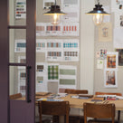 Dining Table with Lots of pictures on the wall - NiX
