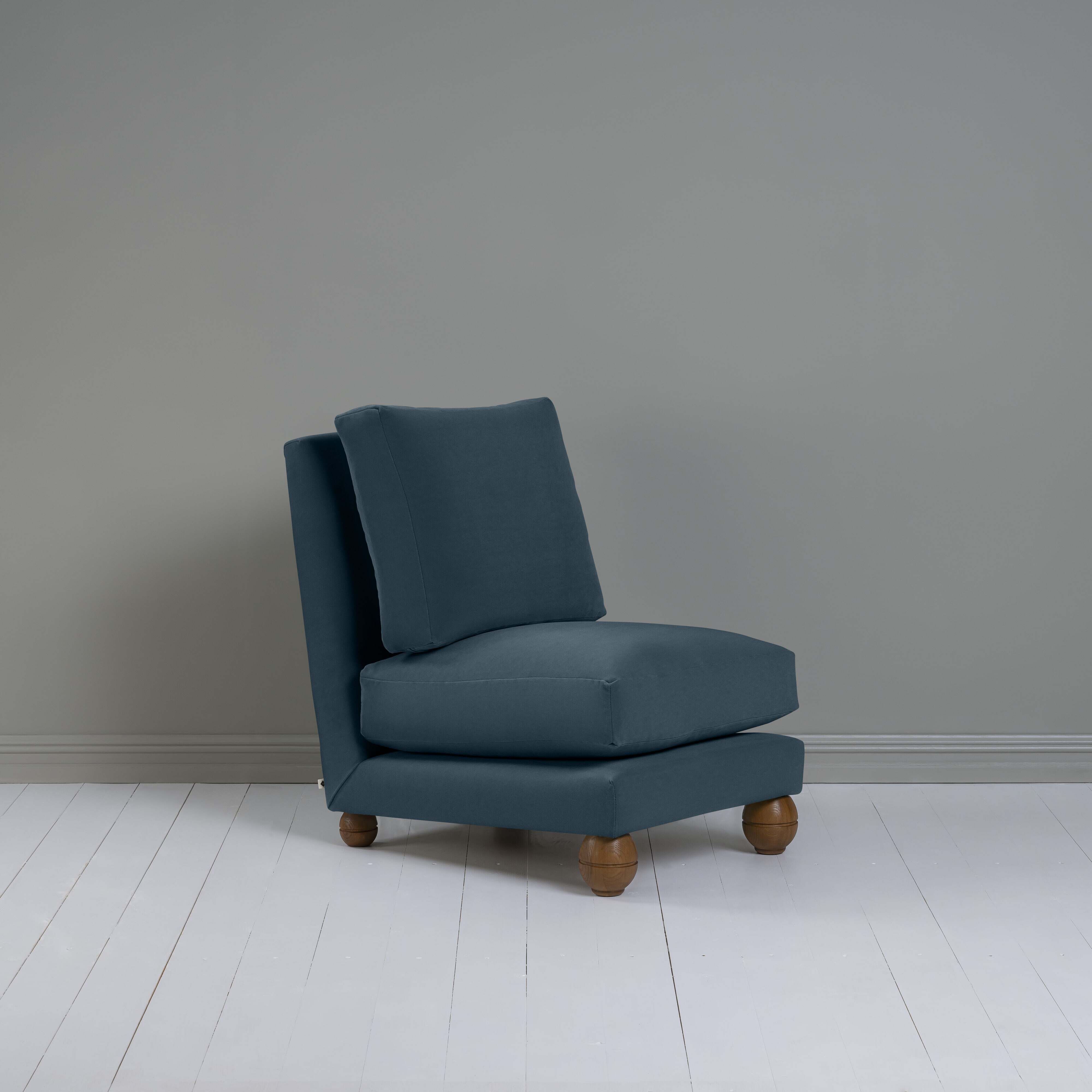 Perch Slipper Armchair in Well Plaid Frame and Intelligent Velvet Mineral Seat, With Cushion, an Ottoman, and a  Brass Base Floor Lamp With, To The Point Paper Empire Lamp Shade in Soft White with Peacock Blue Trim - Nicola Harding