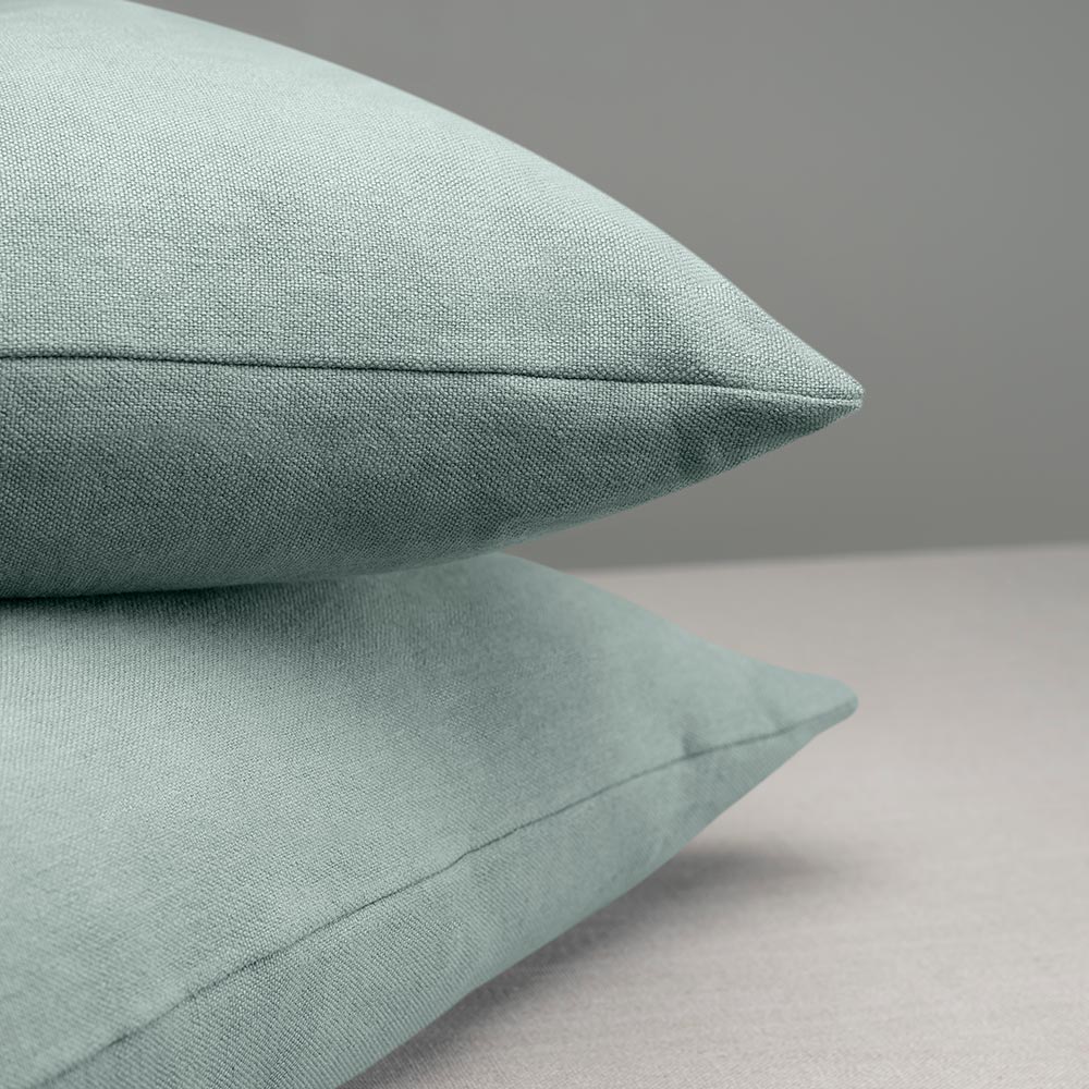 2 Square Kip Cushion in Laidback Linen, Mineral on top of each other